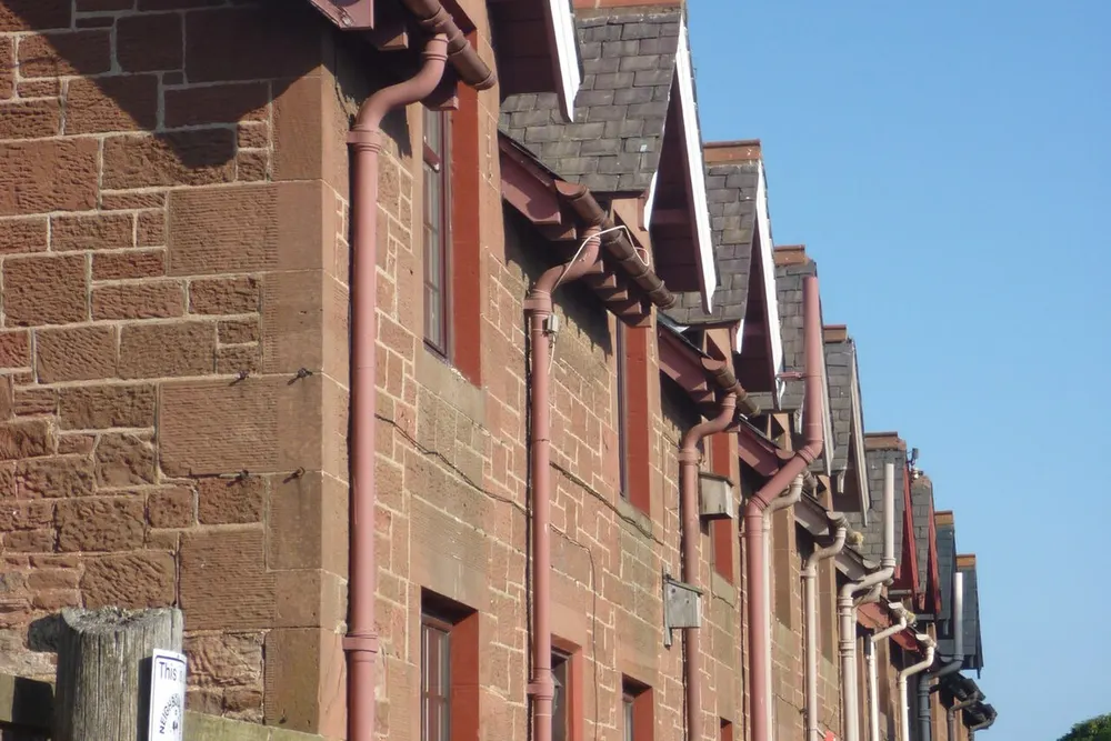 Downpipes and guttering — stormwater must clear away from the building