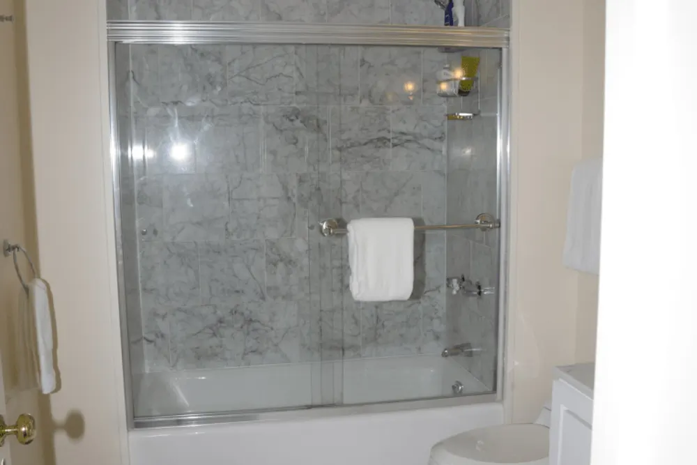 Tiled wet room — floors, walls, and fixture seals are moisture risk points