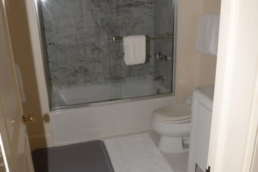 Shower recess tiling — falls, grout, and waterproofing clues matter